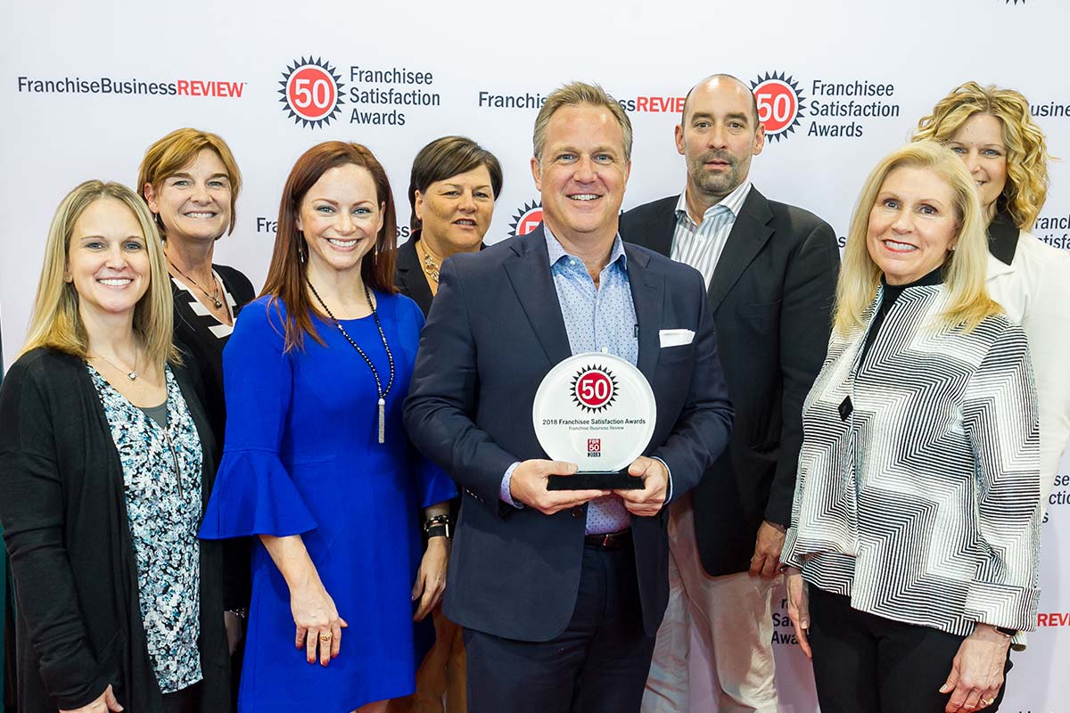 Home Instead leaders accept Franchise Business Review Franchisee Satisfaction Award